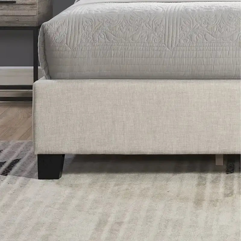Lit plateforme rembourré en polyester beige avec tête de lit capitonnée à oreilles