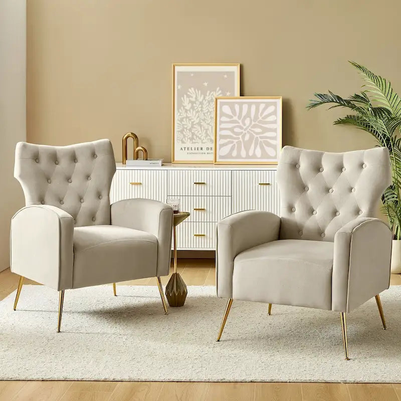 Fauteuil contemporain en velours capitonné à dossier haut avec pieds évasés en métal doré