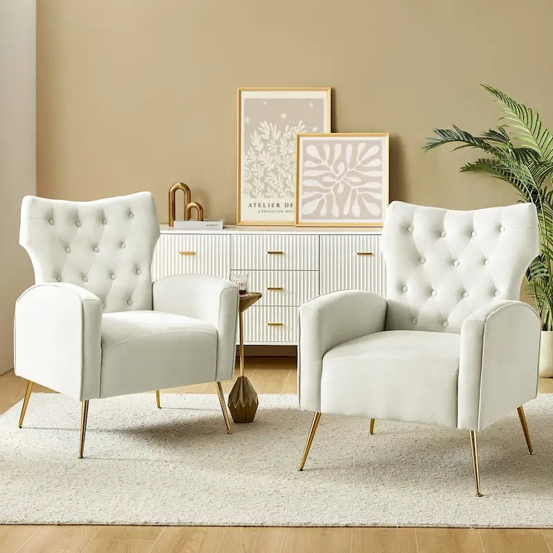 Fauteuil contemporain en velours capitonné à dossier haut avec pieds évasés en métal doré